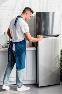 adult-man-opening-friedge-door