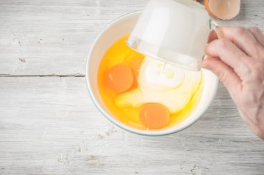 mixing-eggs-and-yogurt-in