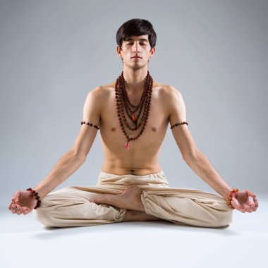 depositphotos 172080420 stock photo young man doing yoga