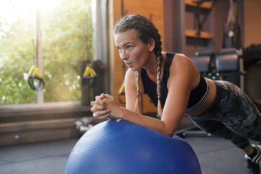depositphotos 230325730 stock photo woman gym planking swiss ball
