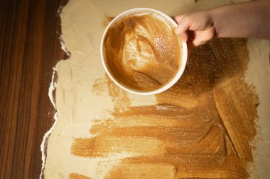 spreading-filling-flattened-dough-baking